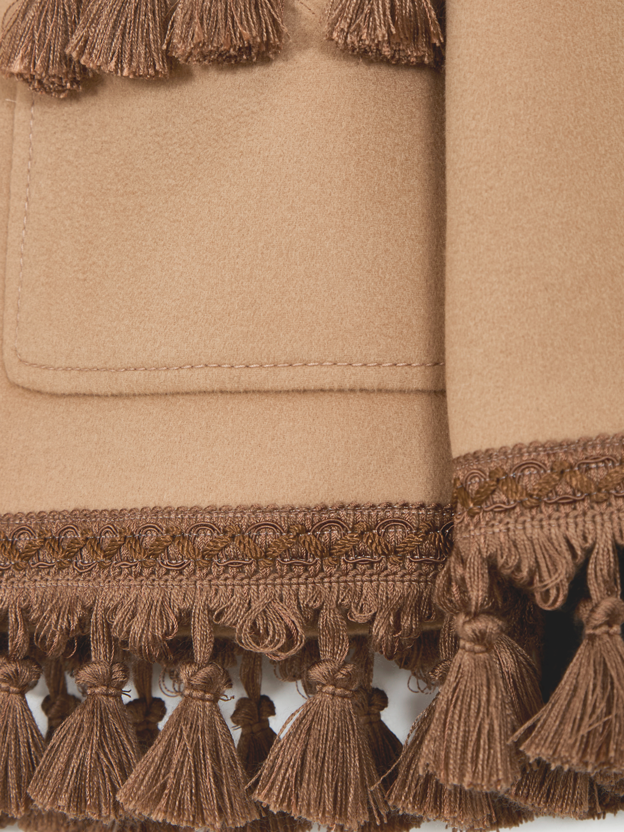 Coat with tassels