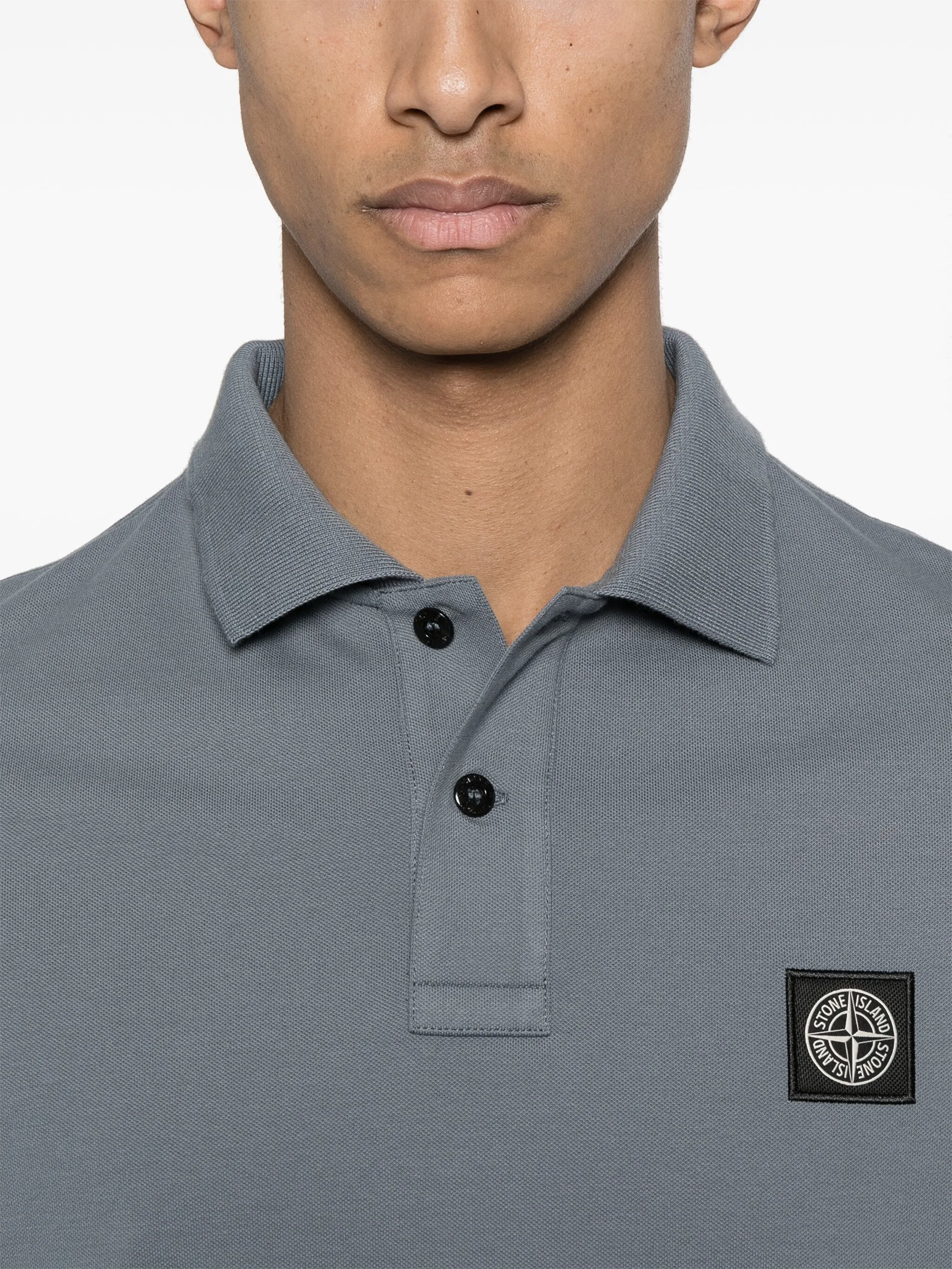 Polo con parche Compass