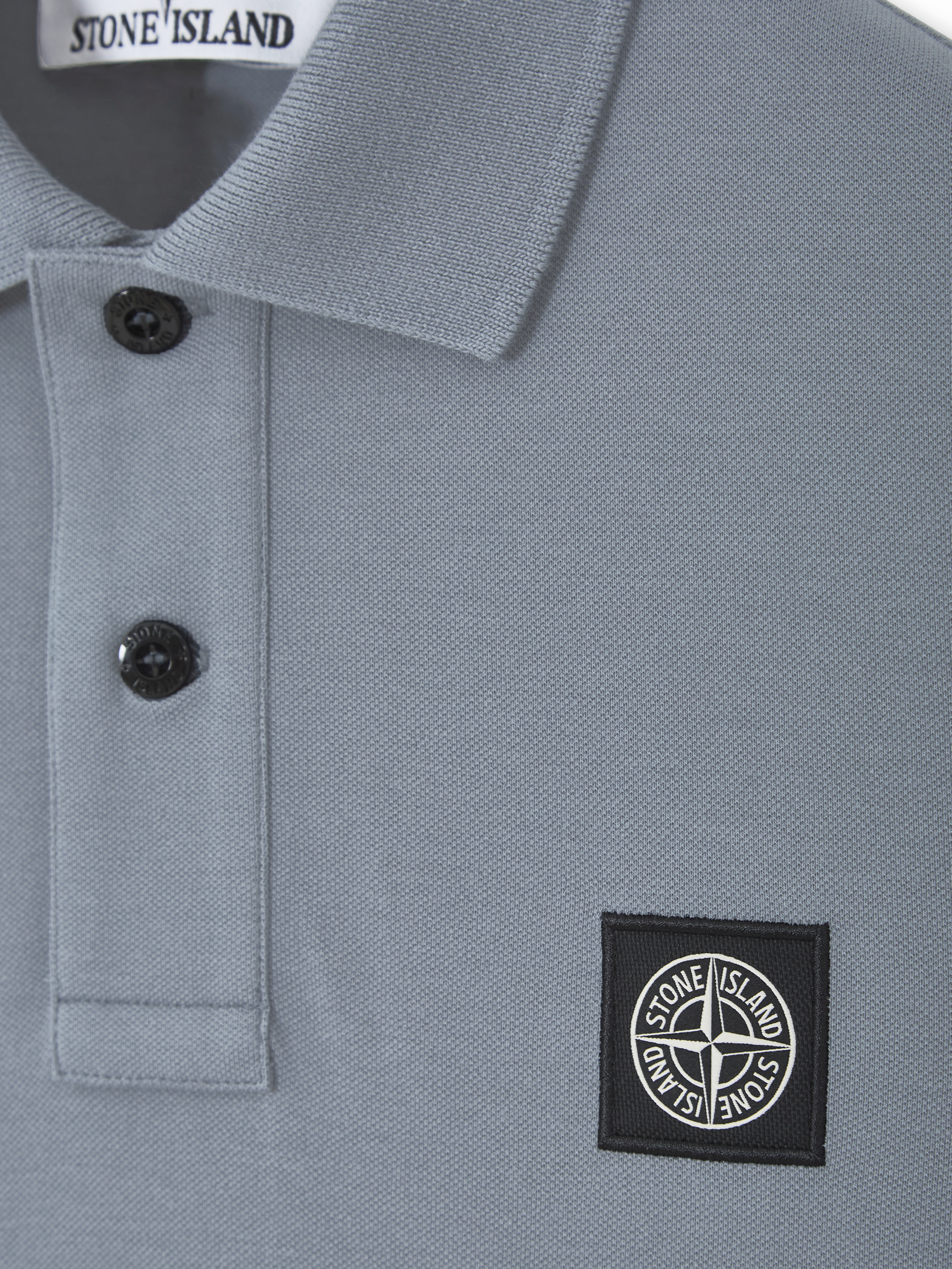 Polo con parche Compass