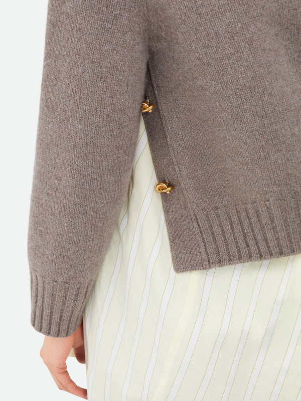 Wool jumper with knot buttons