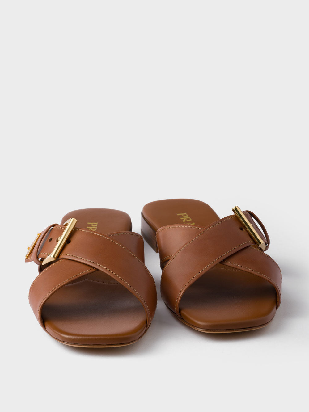 Buckle-fastening sandals
